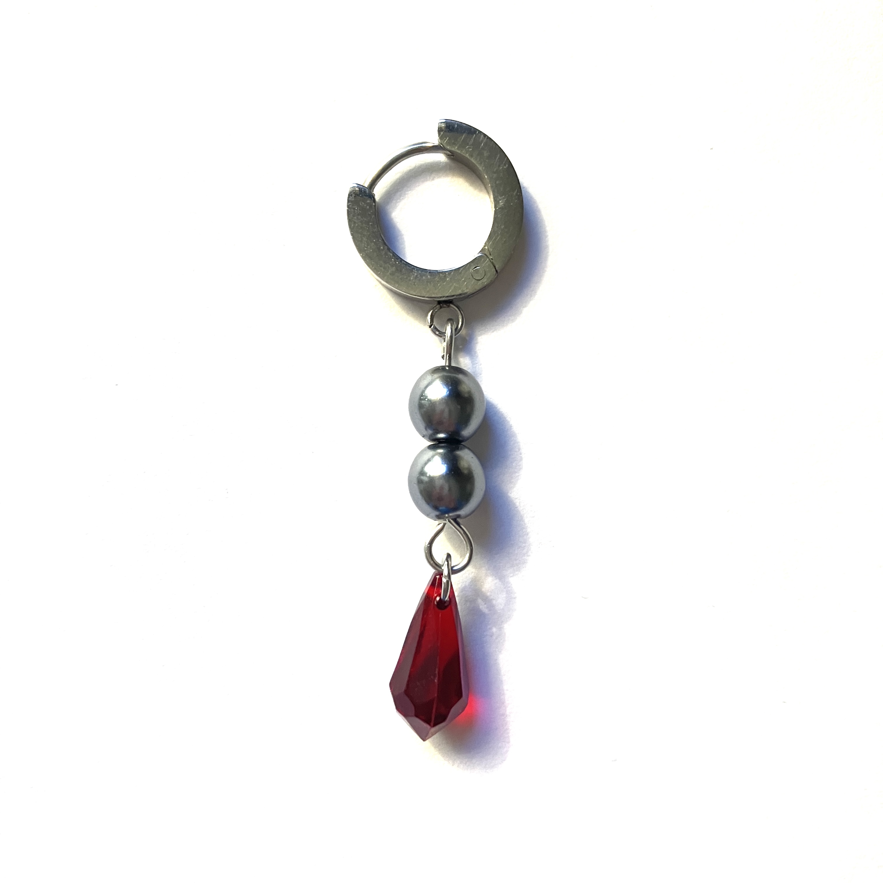 Pyrrhic Silva Craft's rendition of Tartaglia's signature earrings from the game Genshin Impact.